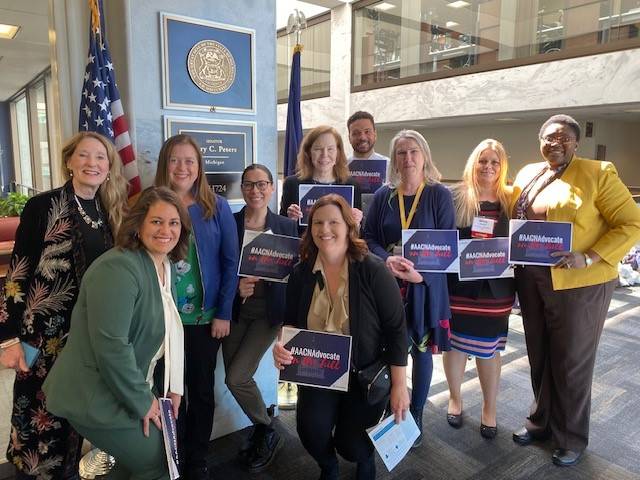 Group of conference attendees together in group
